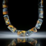 Edelsteincollier Tiger- Falkenauge, polierte Zylinderformen mit 12mm Durchmesser, Stirnseiten bombiert, Länge 44.5cm
