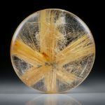 Sternrutil 28.57ct. runder Cabochon, beidseitig bombiert geschliffen und poliert, ca.26x26x5.5mm