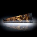 Bronzit 60.91ct. trapezförmig geschliffener Stab poliert, Halbrundprofil ca.63x22x6mm