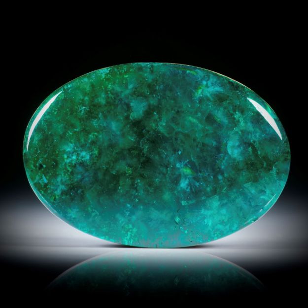 Dioptas 51.43ct. ovaler Cabochon, Oberfläche bombiert und poliert, ca.35.2x24.5x6.3mm